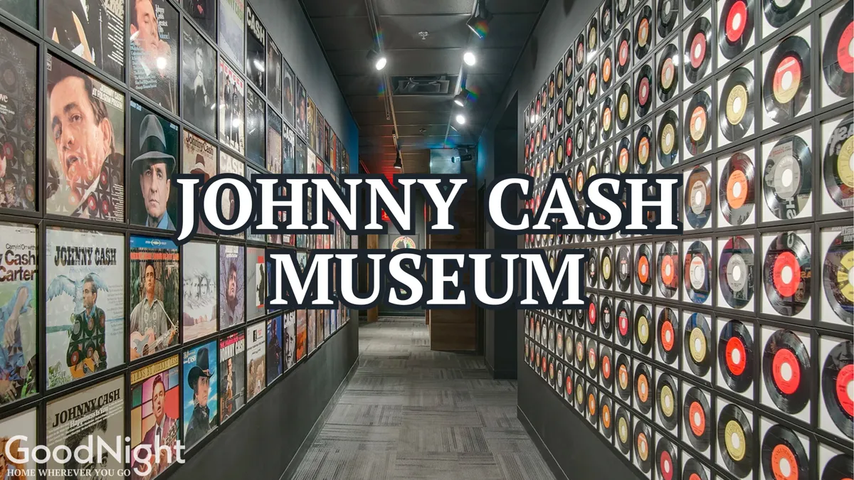 An interior view of the Johnny Cash Museum, showcasing walls adorned with album covers, vinyl records, and museum signage. The immersive exhibits invite visitors to explore the city's rich music history.
